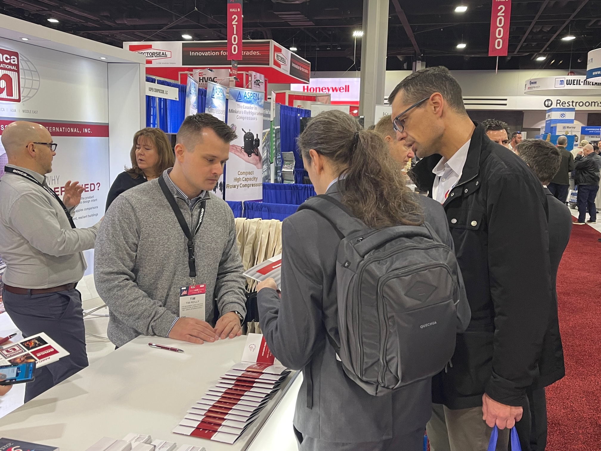 Laboratory Process and Technology Manager Tim Reilly talks AMCA with attendees at the 2023 AHR Expo.